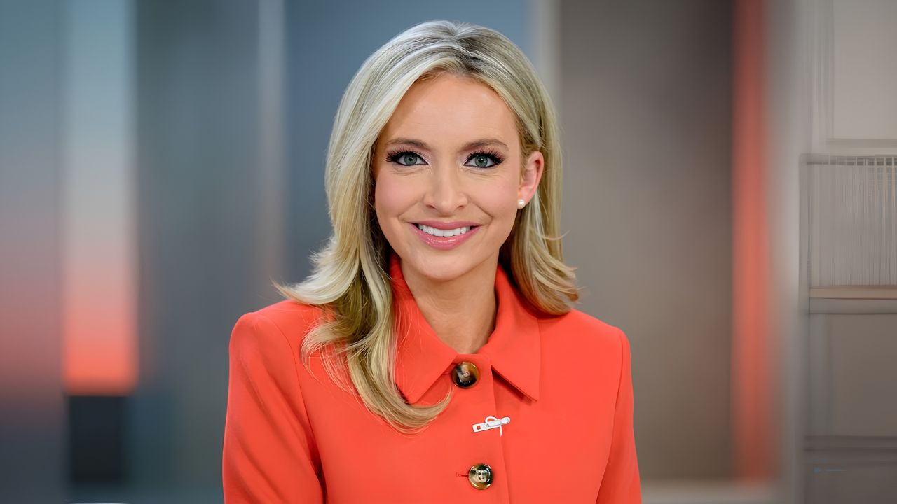 Kayleigh McEnany standing at the White House press briefing podium during a 2020 press conference