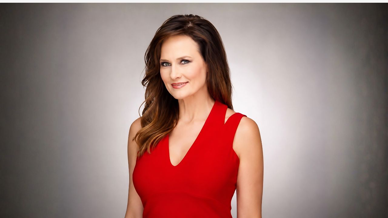 Kathy Sabine age 60 posing as 9News Chief Meteorologist in Denver Colorado studio